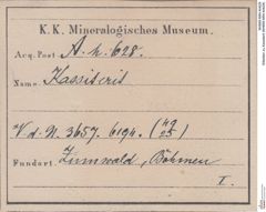 Etiketten zu Kassiterit (NHMW-MIN-Ah628)